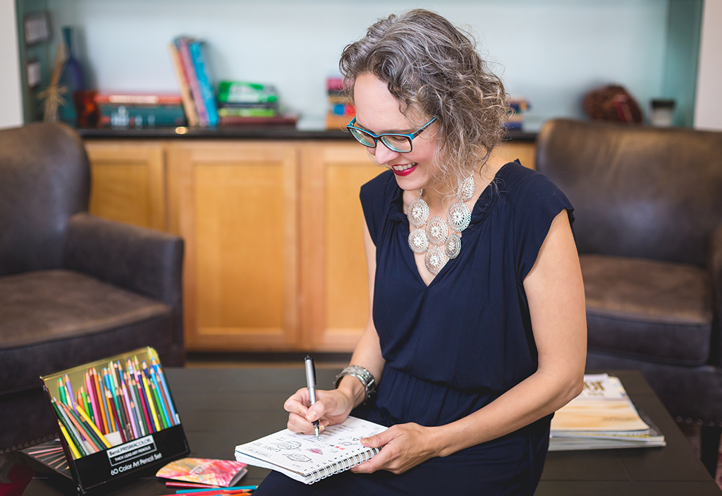 Lidia sketching in book 