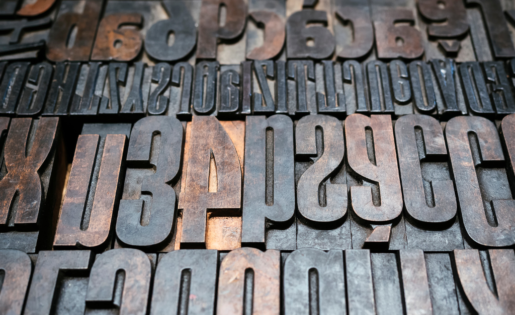 Printing press type letters.